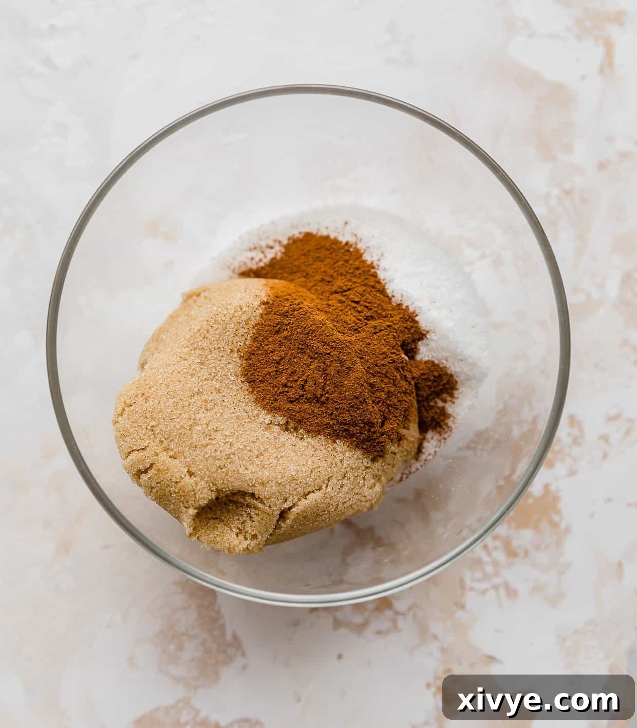 Caramel Apple Pie Fusion 4 A glass bowl with granulated sugar, brown sugar, and cinnamon in it.