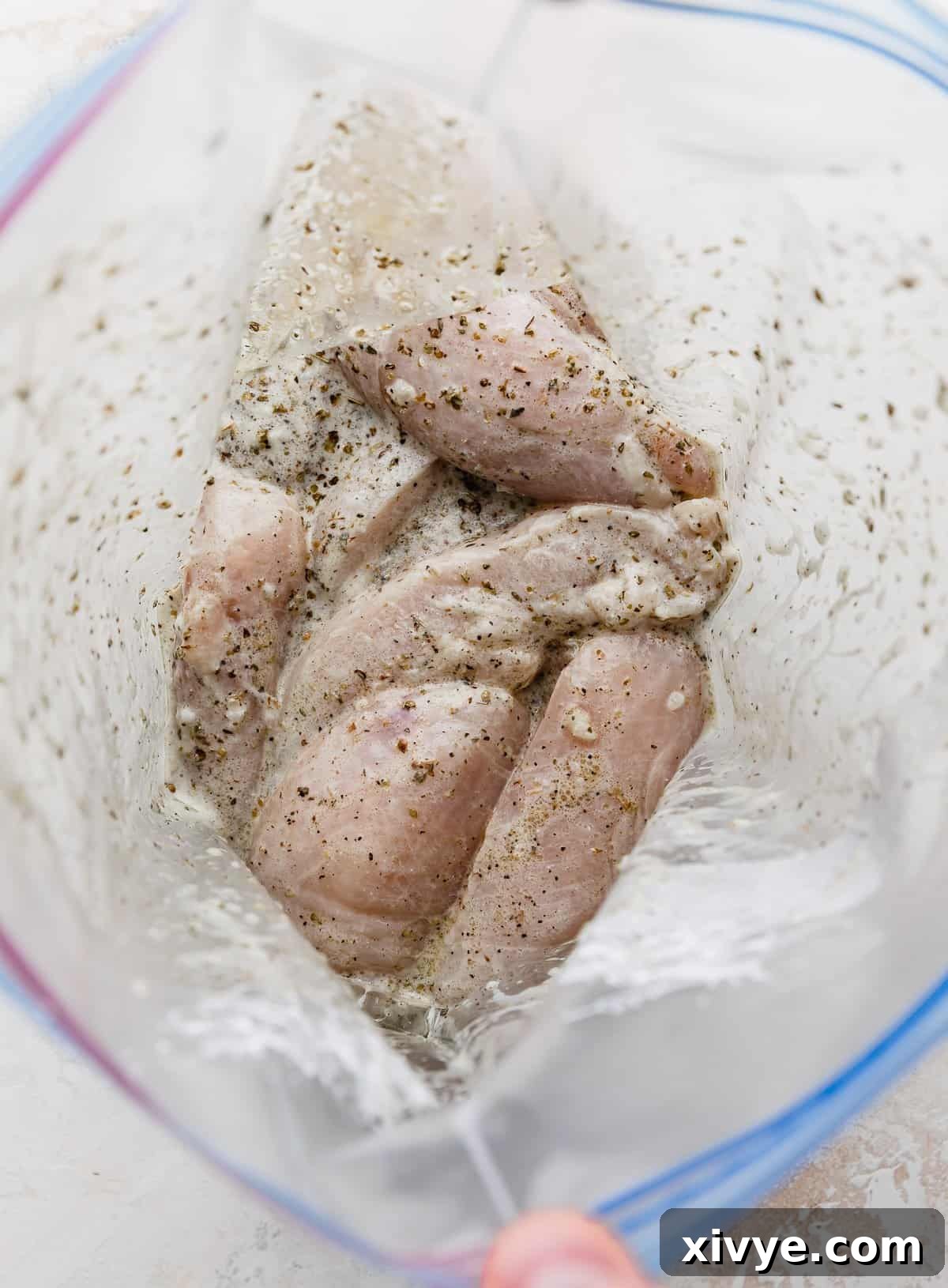 Chicken gyro marinade in a ziplock bag with chicken tenders.