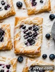 Flaky Blueberry Dream 12 A blueberry danish recipe with fresh blueberries on top of a cream cheese filling and topped with a glaze.