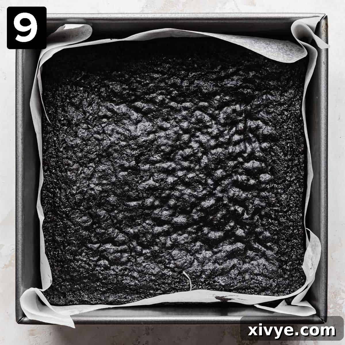 Ultimate Blackout Brownies 6 A square baking dish with black cocoa brownies in it, with a crackly top.