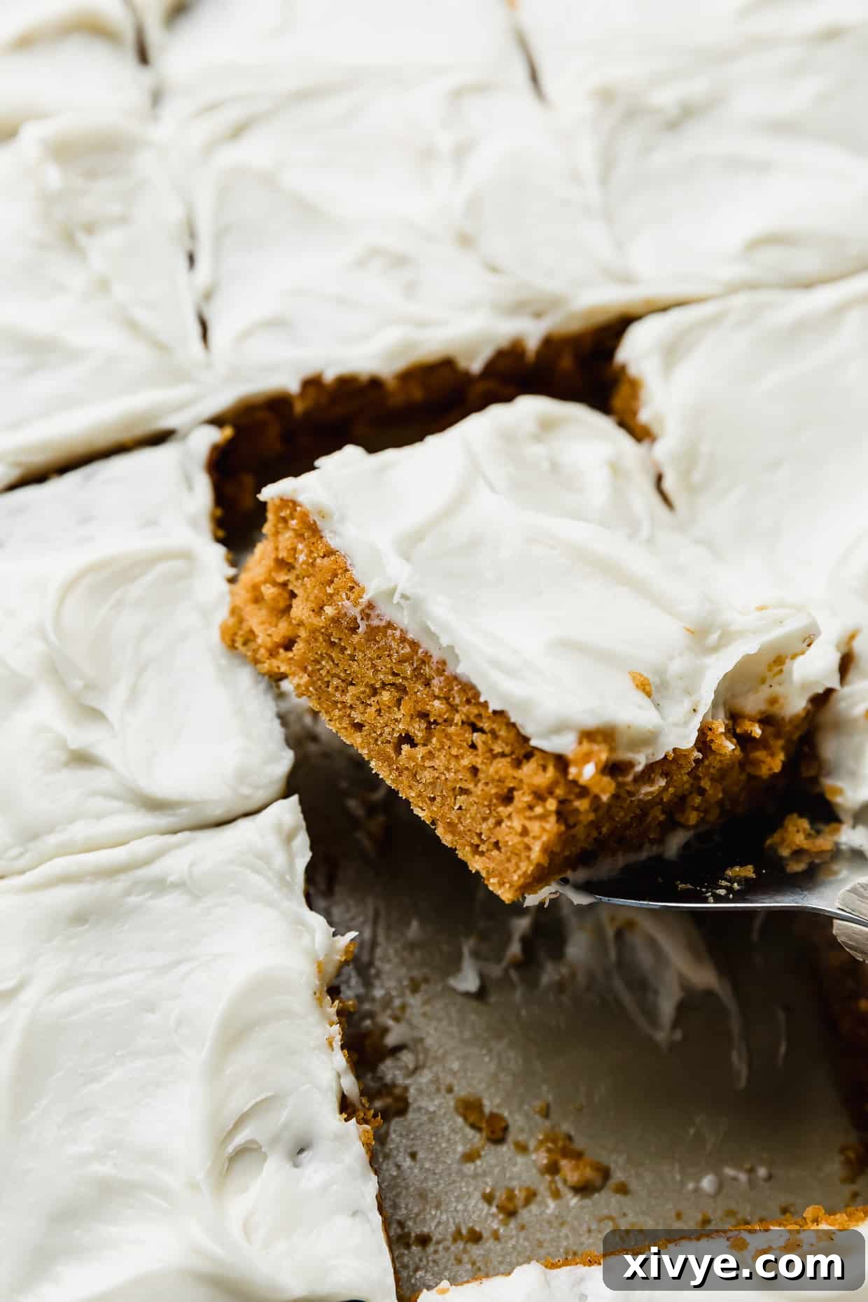 Libby's Pumpkin Bars Recipe with cream cheese frosting cut into squares.