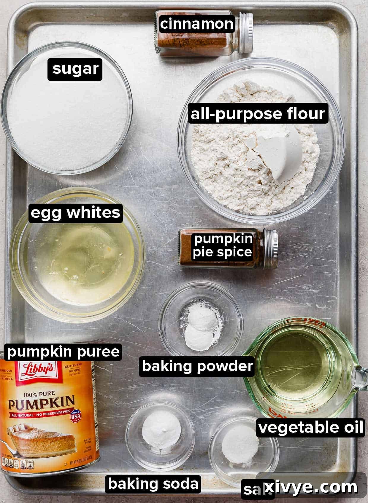 Pumpkin Bars ingredients using Libby's pumpkin puree portioned into glass bowls on a metal baking sheet.