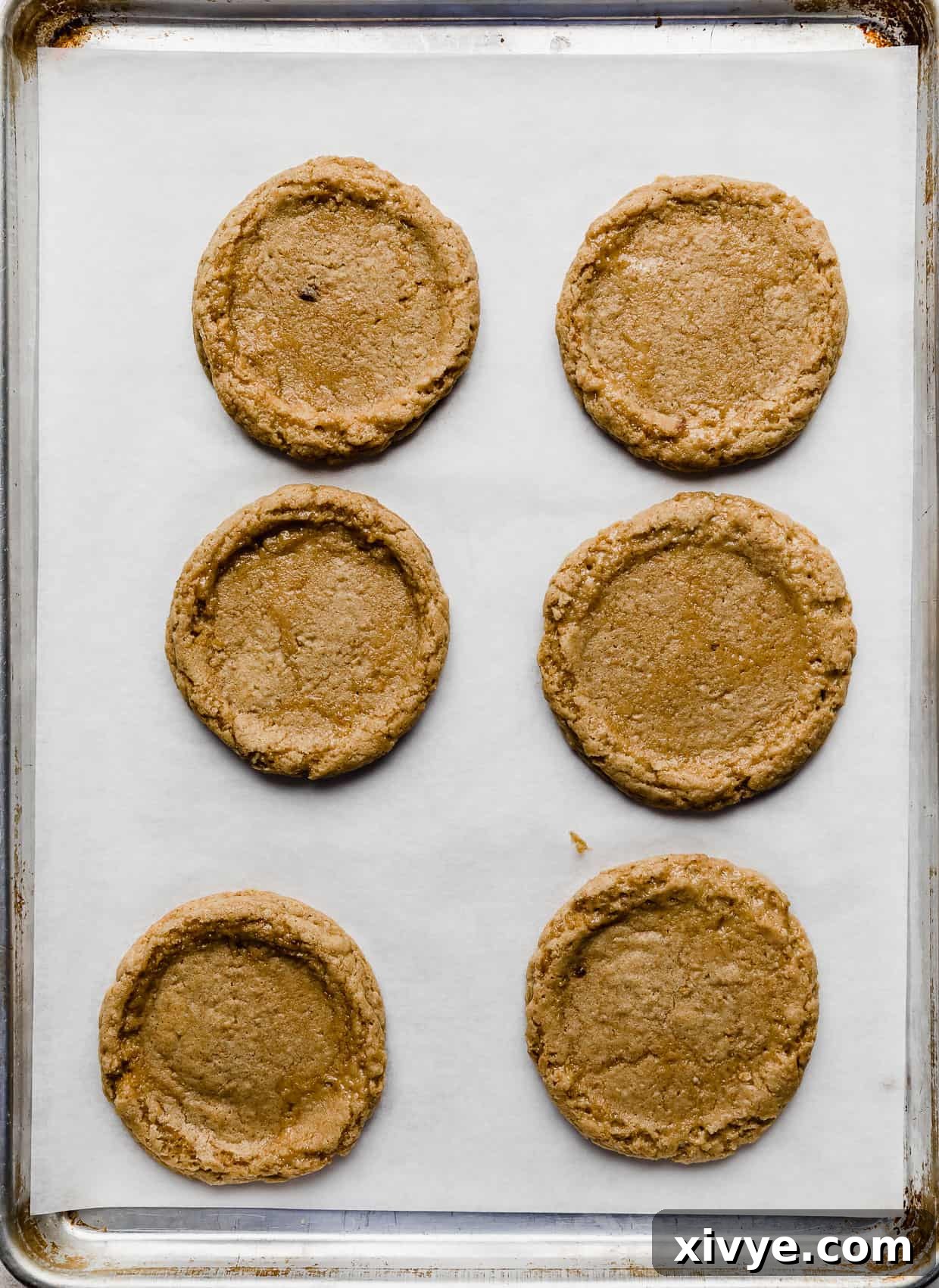 Tangy Key Lime Cookie Delight 7 Six graham cracker cookies on a white parchment paper.