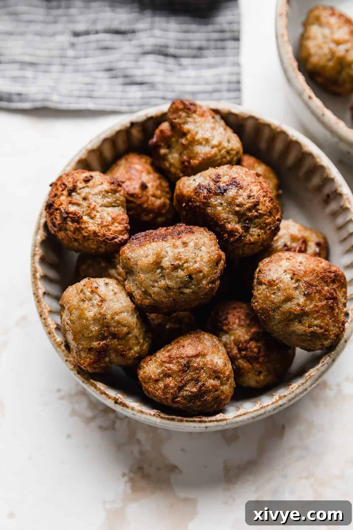 Air fried meatballs in a bowl.