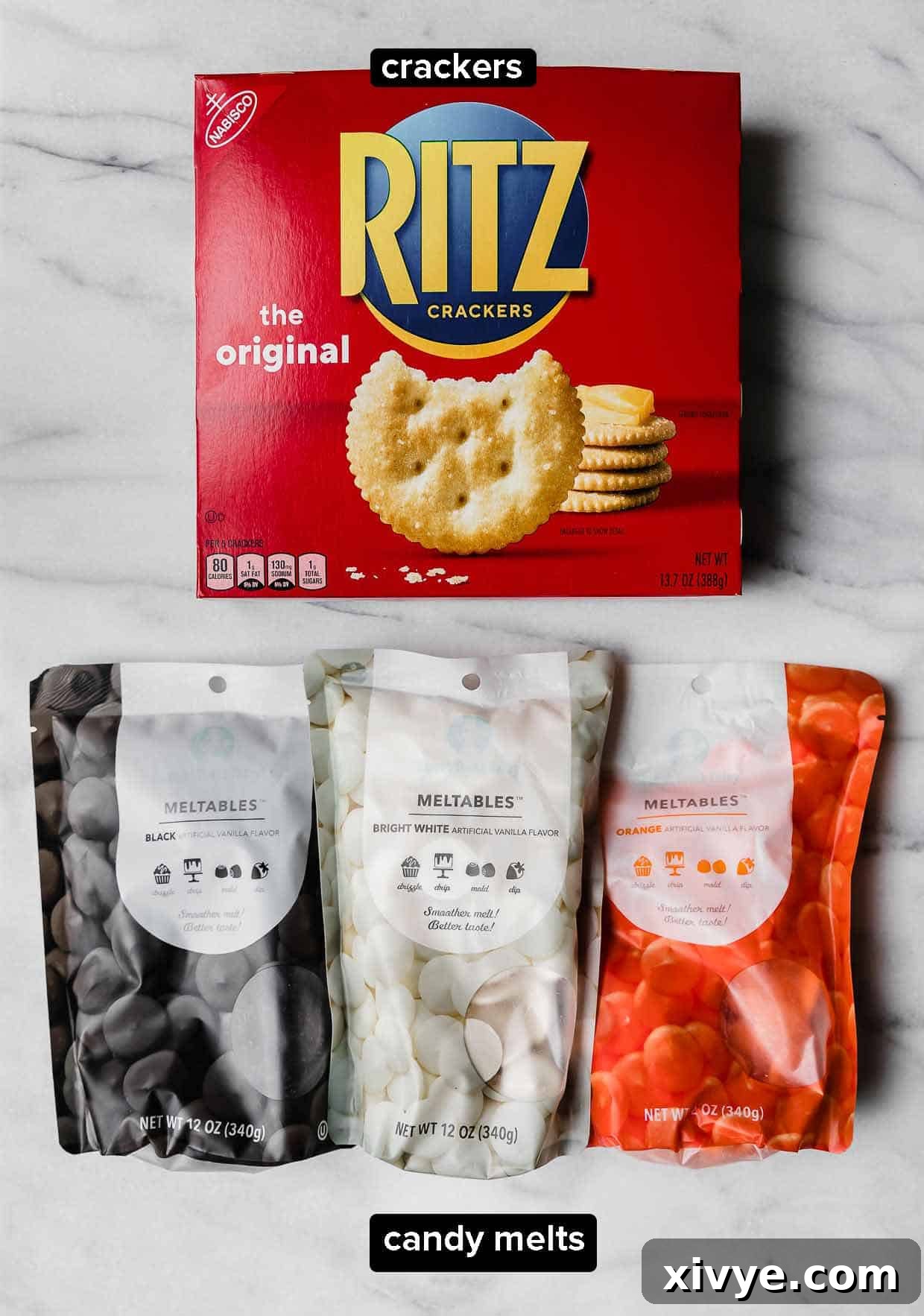 Halloween Cracker ingredients on a white background: Ritz crackers and black, white, and orange melting chocolate.
