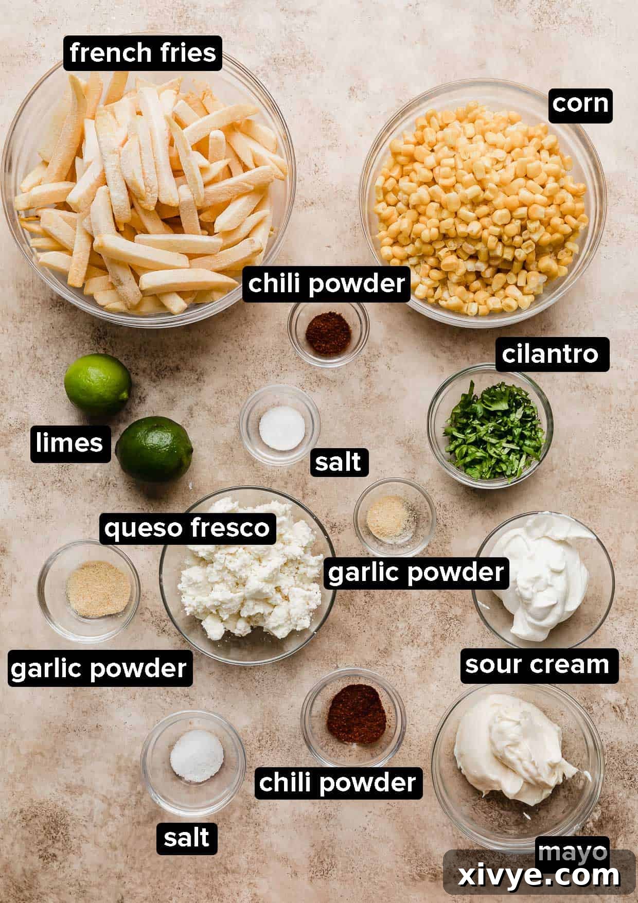 Golden Corn Sticks 3 All the Corn Fries ingredients, carefully portioned into elegant glass bowls, arranged on a warm, tan textured background.