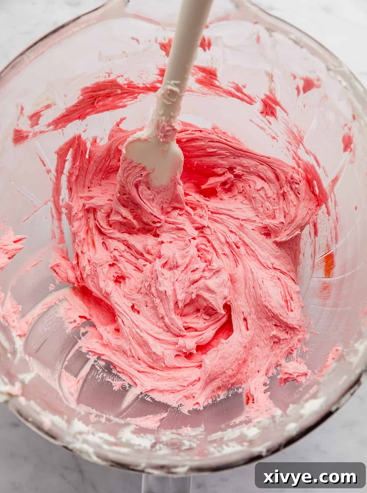 Spellbinding Harry Potter Birthday Delight 7 Pink frosting in a glass bowl.