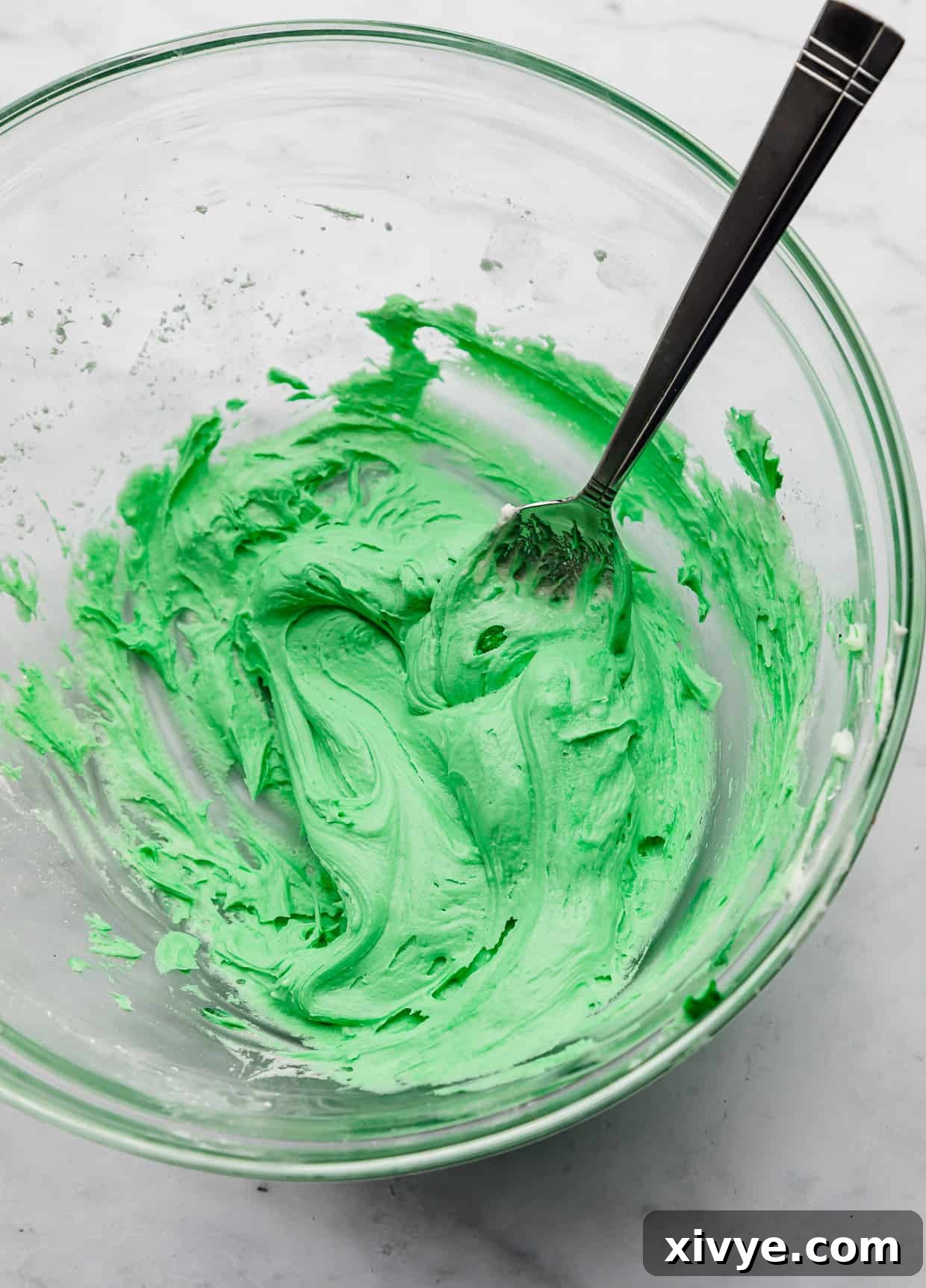 Spellbinding Harry Potter Birthday Delight 8 Bright green frosting in a glass bowl.