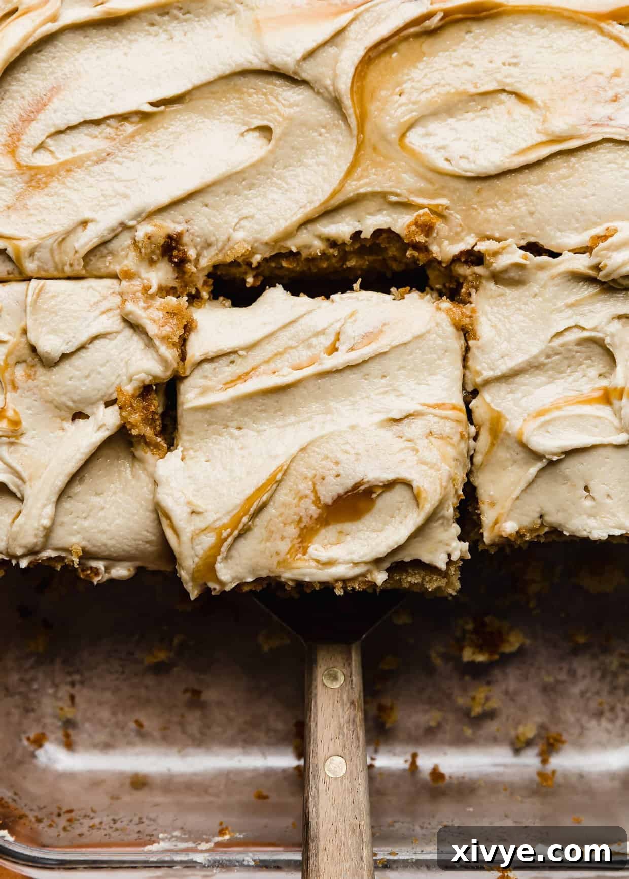 Overhead photo of Butterscotch frosting swirled on a brown butter butterscotch cake.
