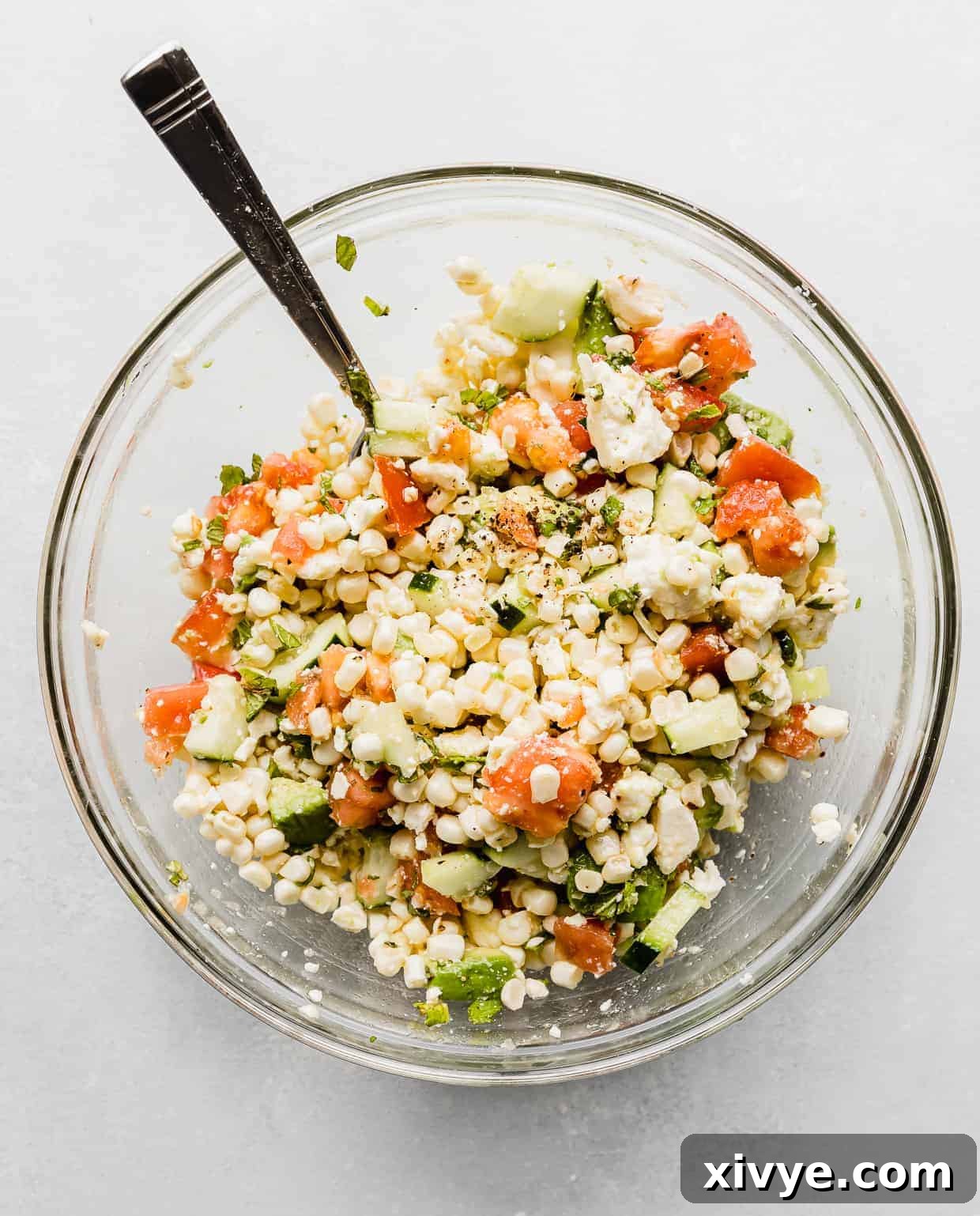 Feta Corn Salad in a glass bowl.
