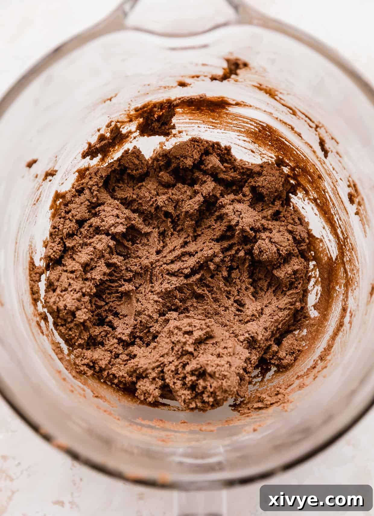 Nutella Cookie dough in a glass bowl, showcasing its rich brown color and smooth texture.