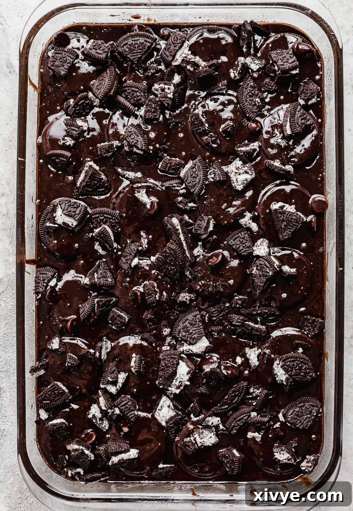 Cookies and Cream Fudge Brownies 9 Chopped oreos sprinkled overtop brownie batter in a rectangle pan.