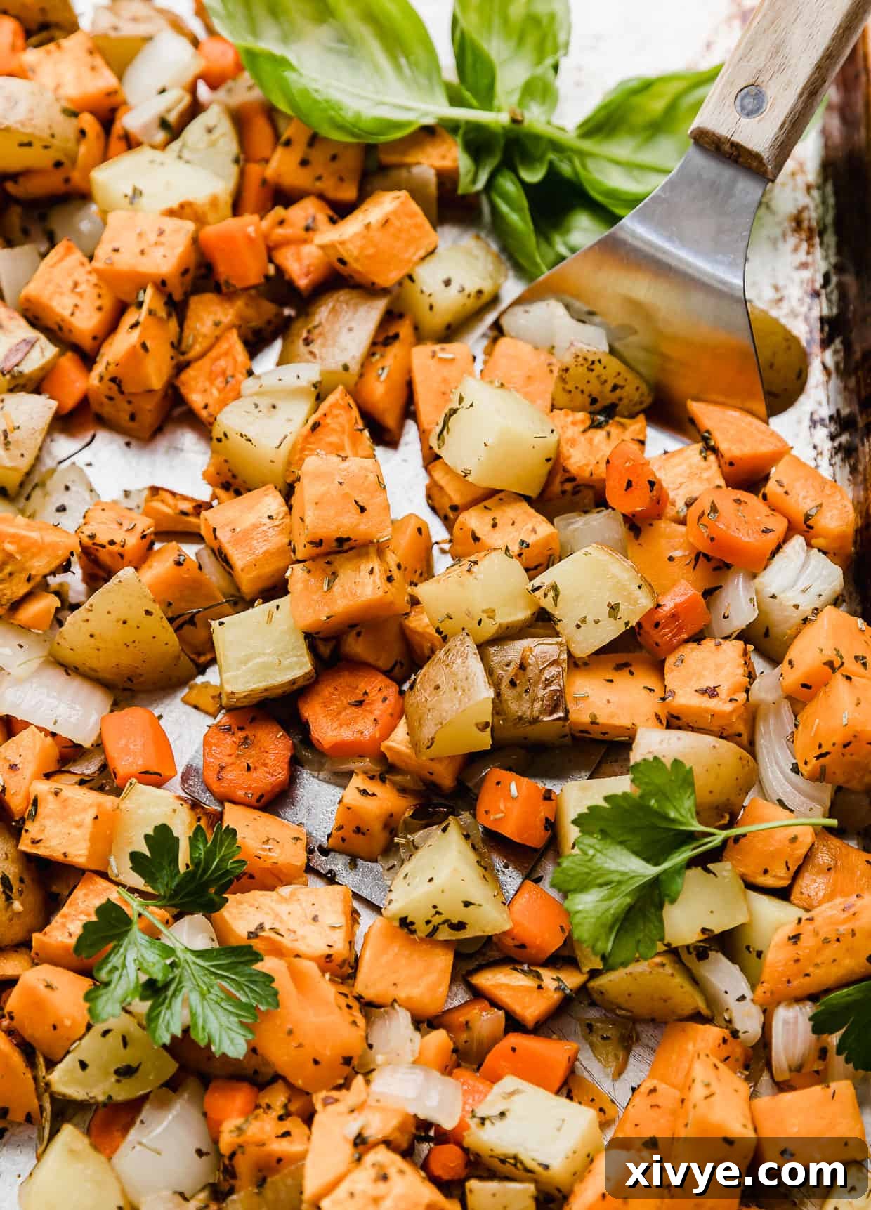 Easy roasted fall vegetables, golden brown and perfectly cooked, displayed on a baking sheet, ready to be served as a comforting side dish.