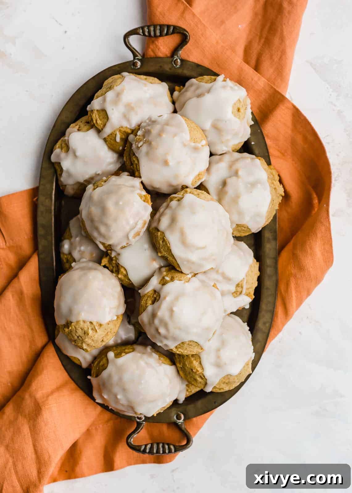 Overhead photo of pumpkin cookies on an oval tray.