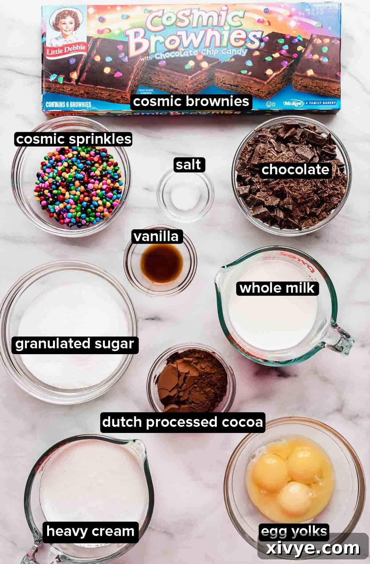 Stardust Brownie Galaxy 3 Cosmic Brownie Ice Cream ingredients portioned into glass bowls on a white marble background.