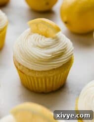A lemon cupcake topped with a swirl of Lemon Buttercream.