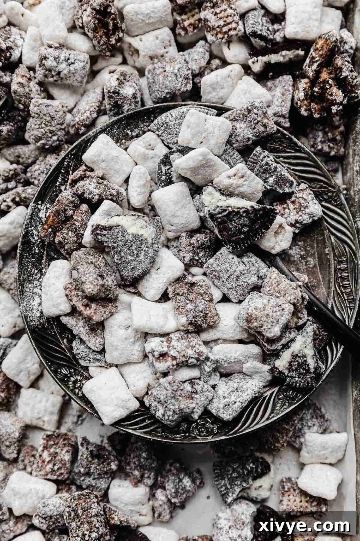 Oreo Muddy Buddies on a silver plate.