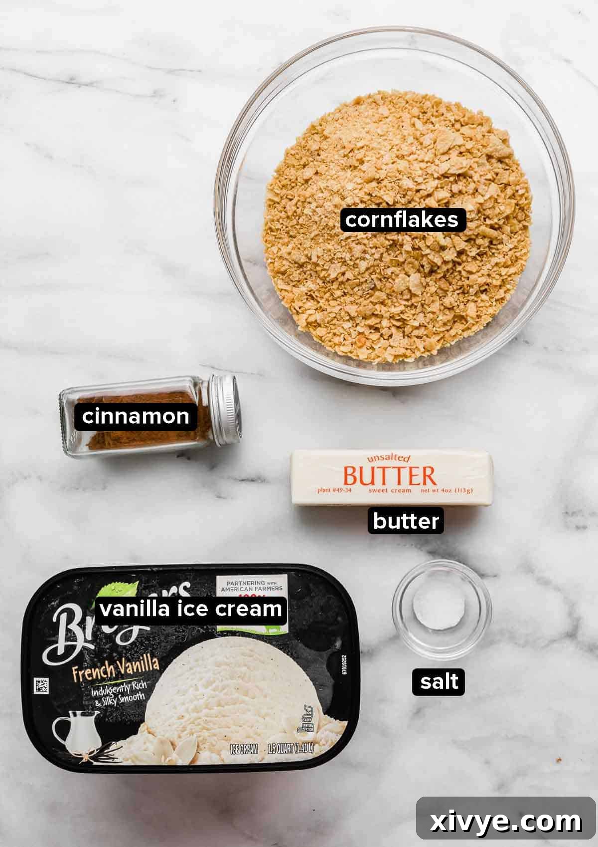 Golden Frost 3 Fried ice cream ingredients on a white background: vanilla ice cream, cornflakes, cinnamon, butter, salt.