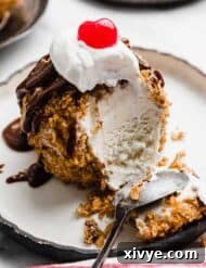 Fried Ice Cream with a spoon scooping through the ice cream ball.