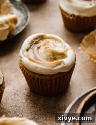 A Butterscotch Cupcake on a light brown background.