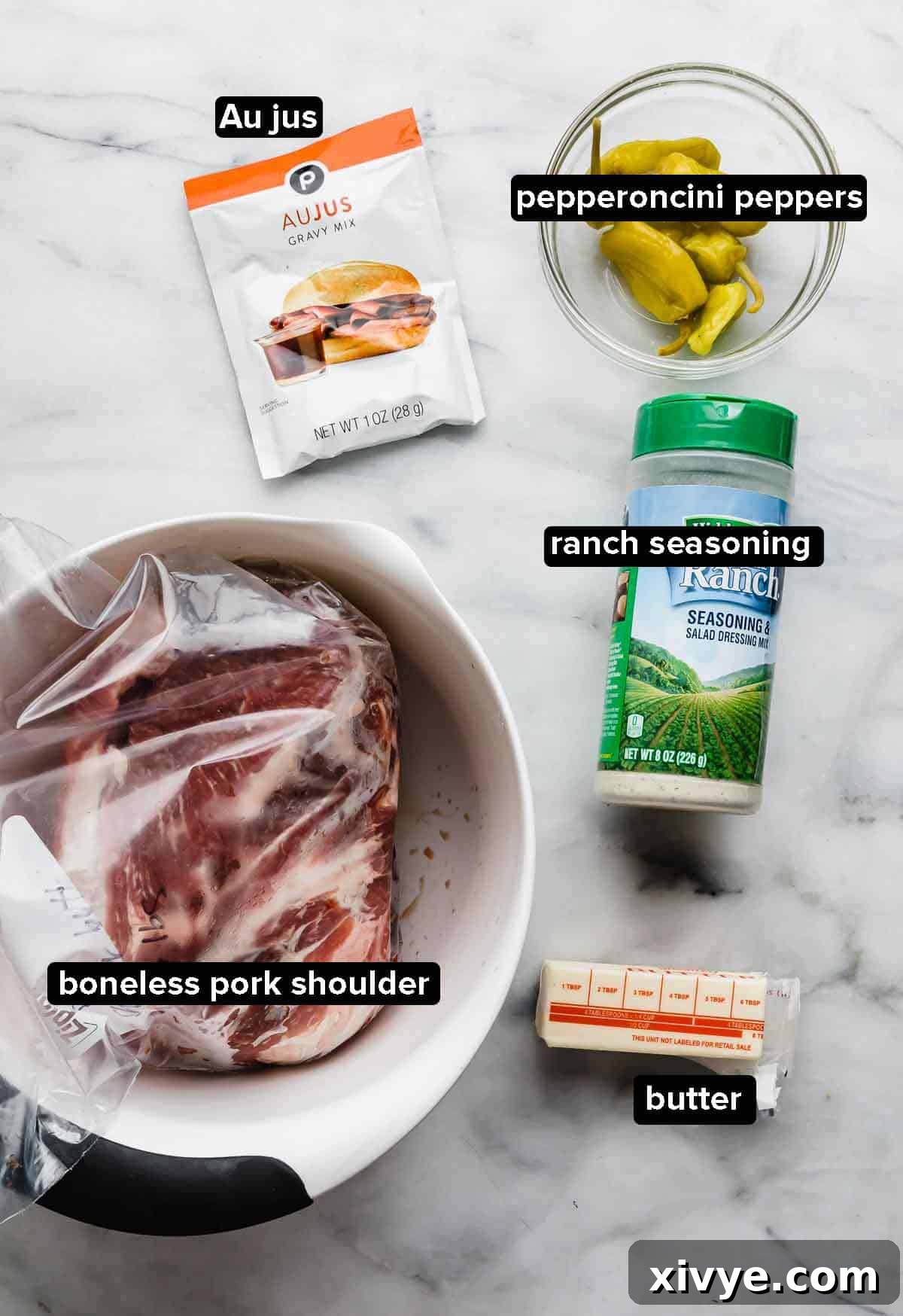 Mississippi Pork Roast ingredients on a white and gray marble background.