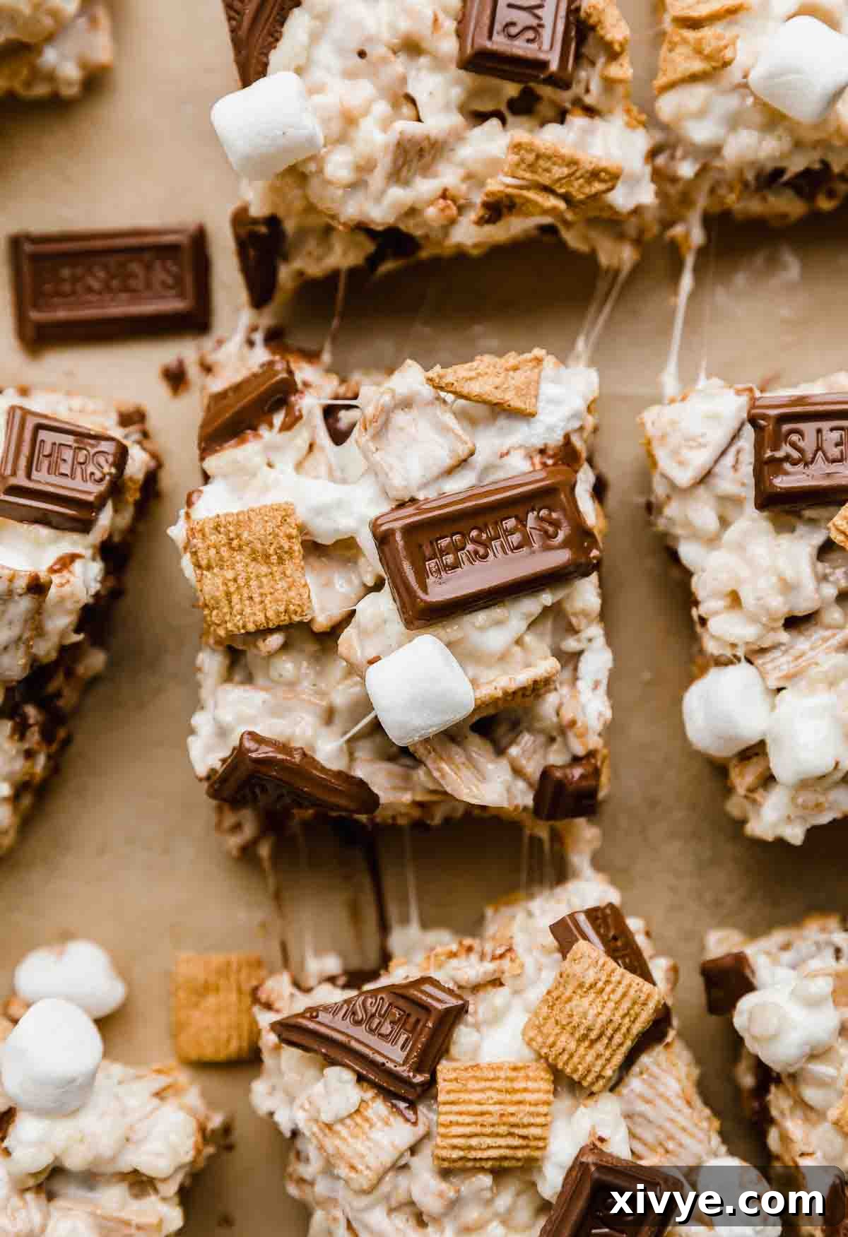 Overhead photo of a S'more Rice Krispie Treats on a Kraft colored parchment. 