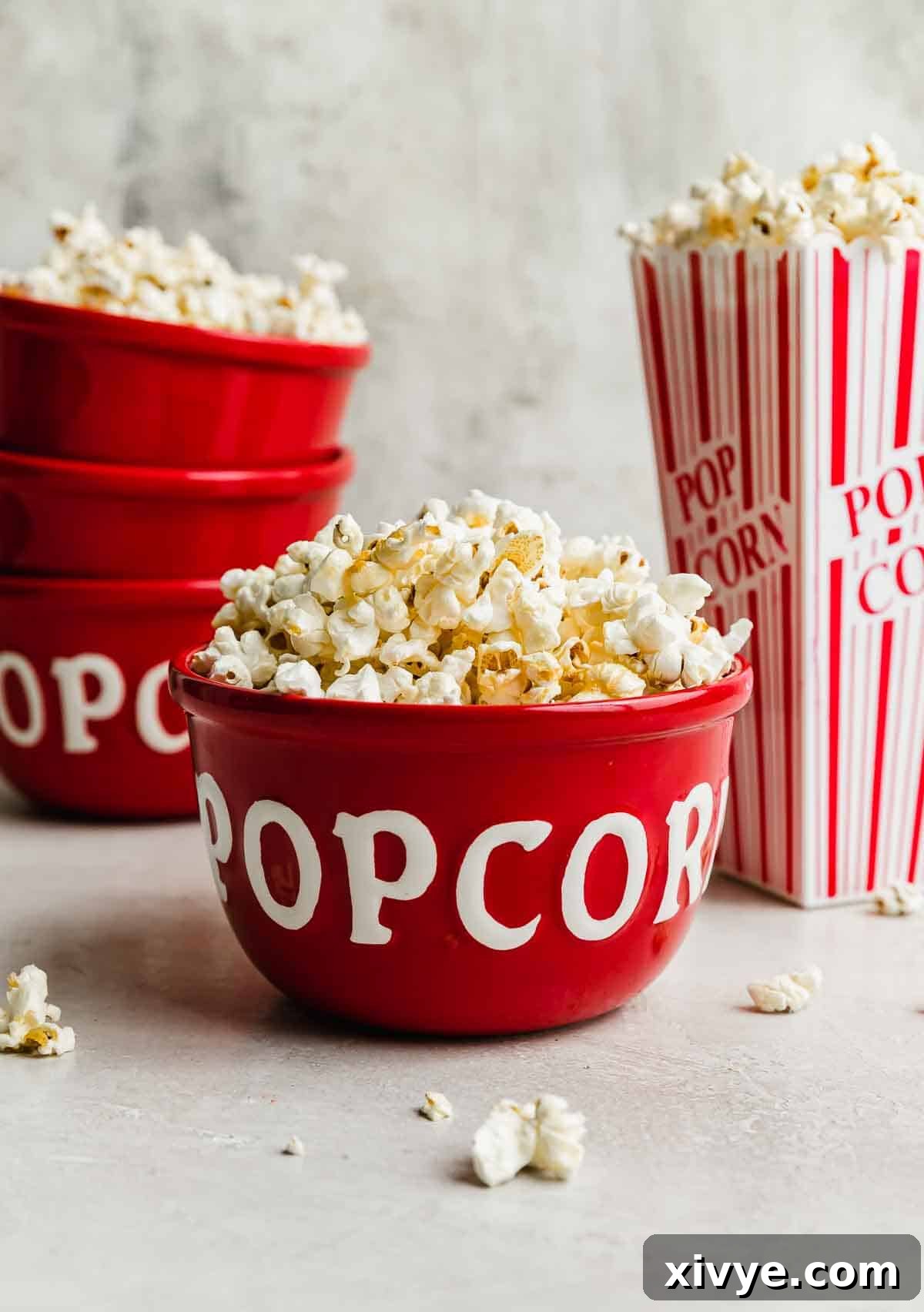 Sweet and Salty Kettle Corn 6 Kettle corn served in a red bowl with the word, "popcorn" written in white on its side.