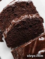 Slices of Chocolate Pound Cake on a white background.