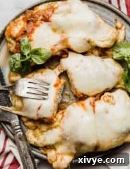 Pesto Chicken Parmesan on a gray plate.