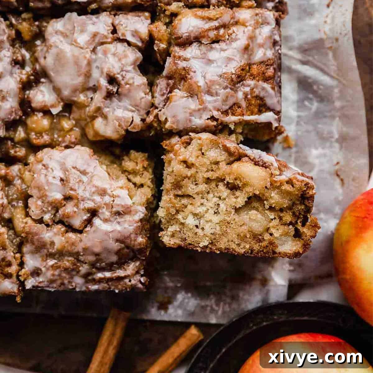 Spiced Apple Fritter Coffee Cake 8 Close up photo of the best Apple Fritter Cake on parchment paper.