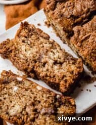 A slice of Cinnamon Swirl Bread on a white plate.