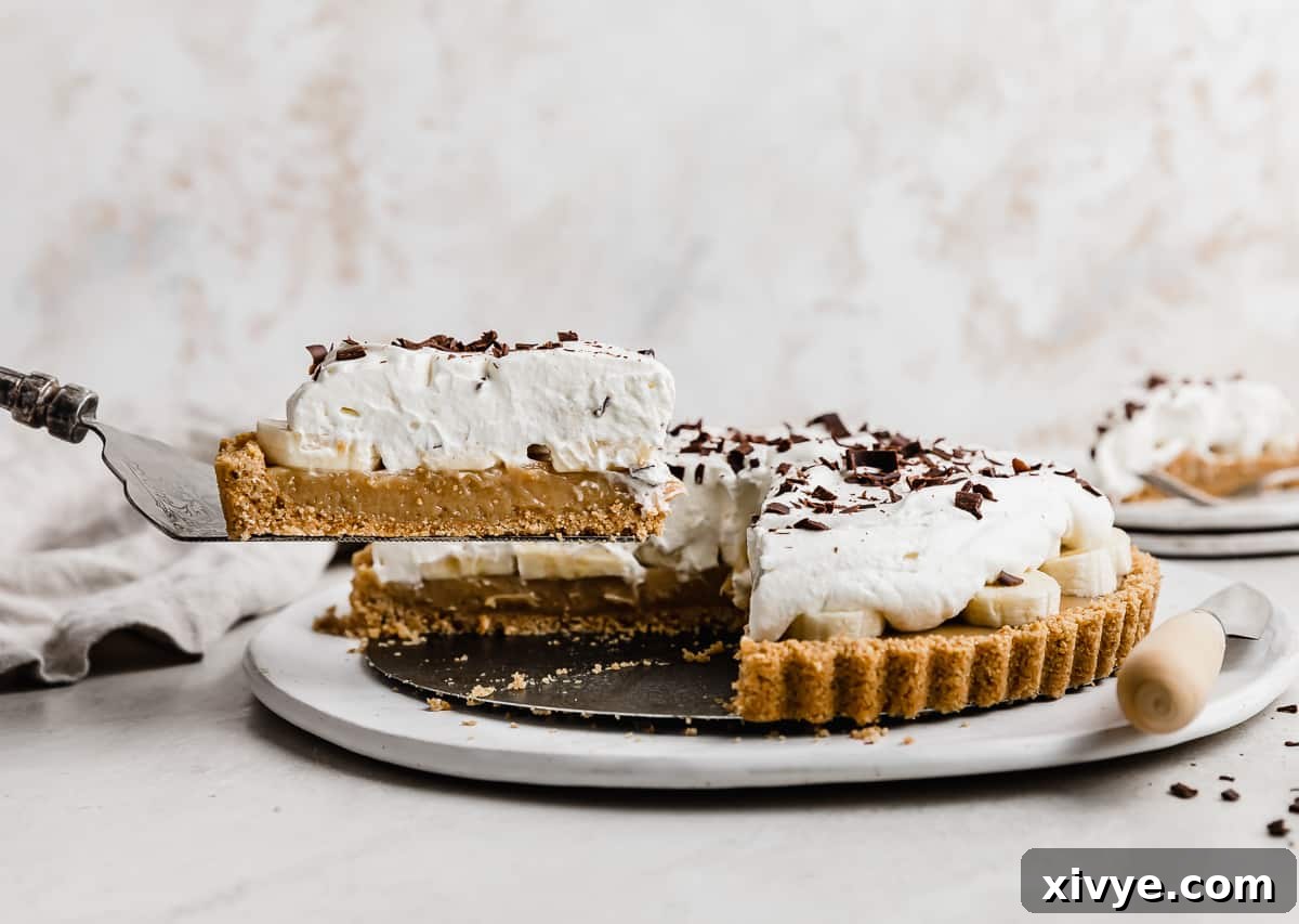 Decadent Banoffee Pie with Crunchy Graham Crust 12 A slice of Banoffee Pie on a metal spatula.
