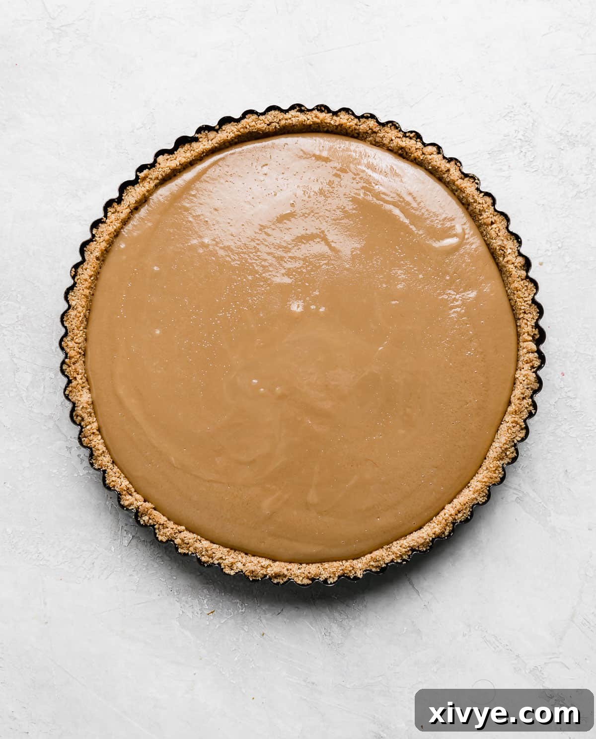 Decadent Banoffee Pie with Crunchy Graham Crust 8 A banoffee pie recipe in a graham cracker crust with homemade dulce de leche.