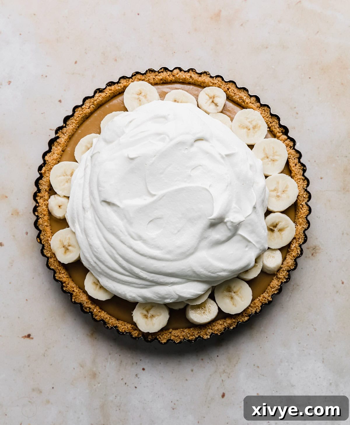 Decadent Banoffee Pie with Crunchy Graham Crust 10 Dollop of homemade whipped cream atop a no-bake banoffee pie recipe with a graham cracker crust.