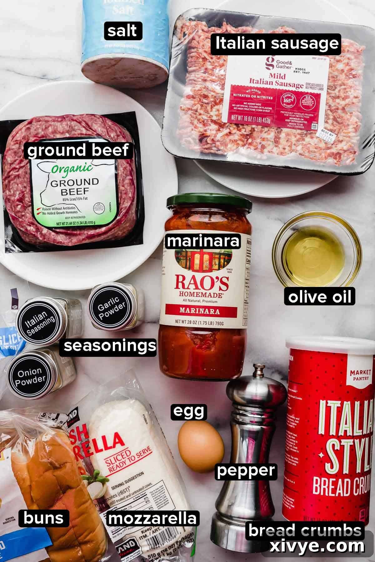 Saucy Italian Meatball Heroes 3 Italian Meatball Subs ingredients on a white background: ground beef, Italian sausage, marinara, bread crumbs, seasonings, egg, and mozzarella.