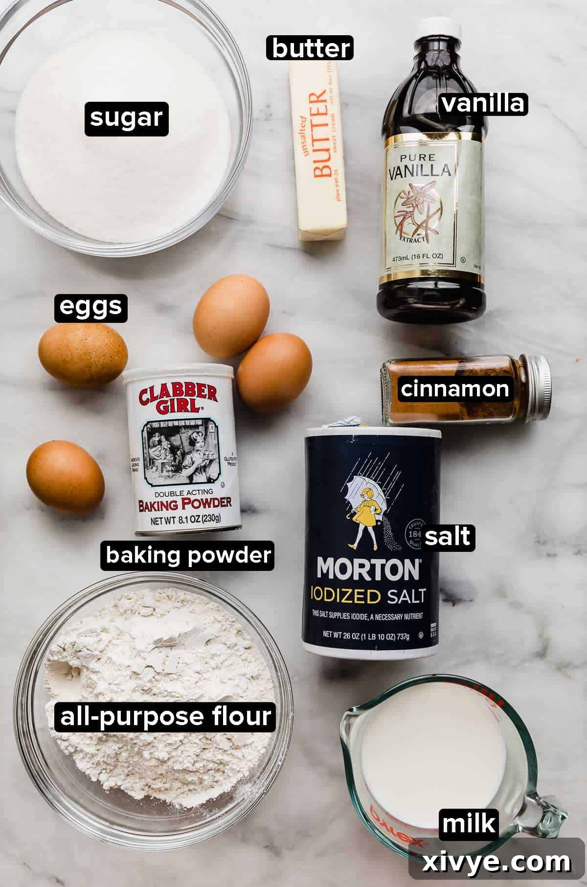 Heavenly Mexican Tres Leches Cake 3 Tres Leches Cake Recipe ingredients on white marble surface (also known as a three milk cake).