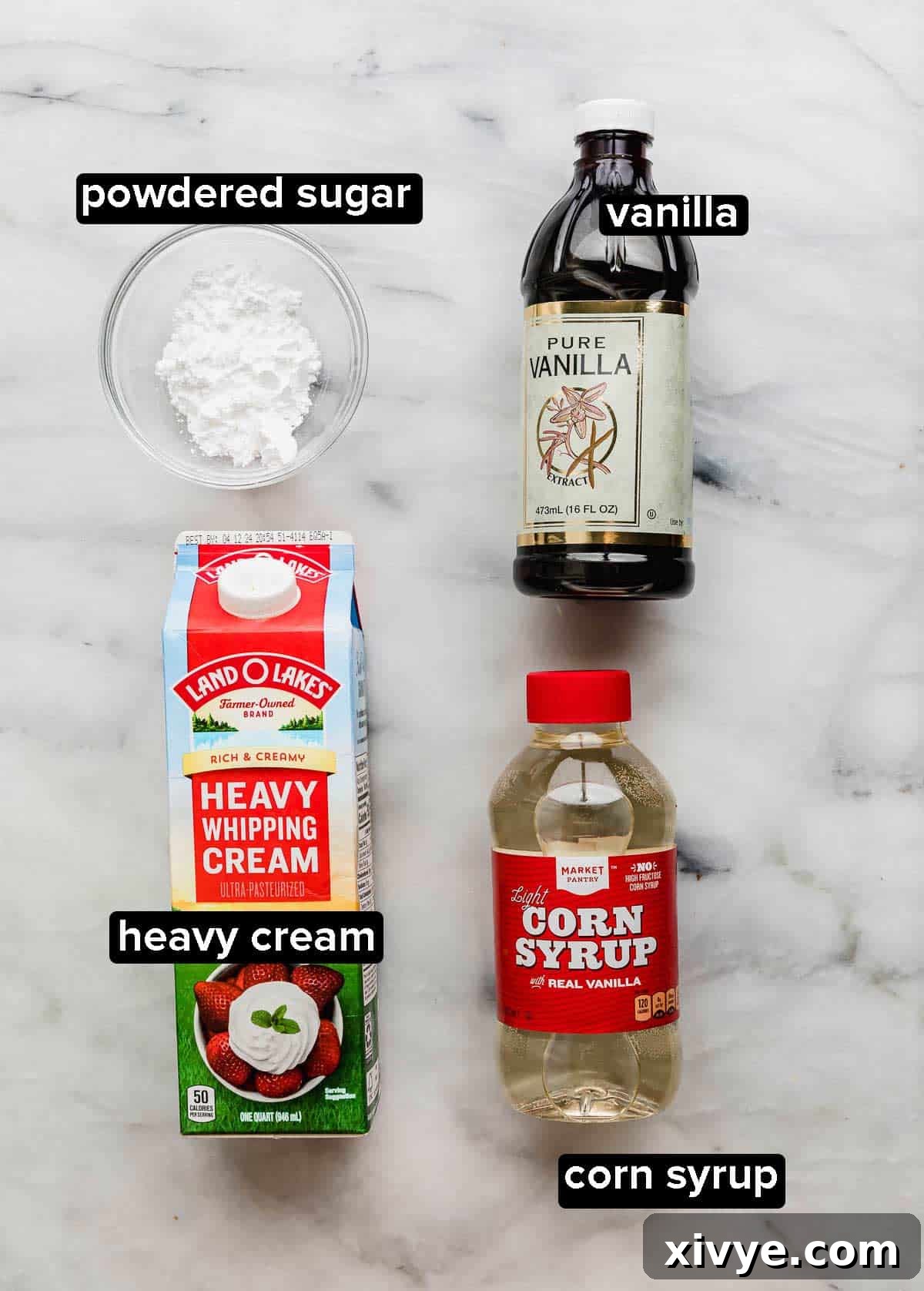 Heavenly Mexican Tres Leches Cake 5 Tres Leches whipped topping ingredients on a white background: vanilla, heavy cream, powdered sugar, and corn syrup.