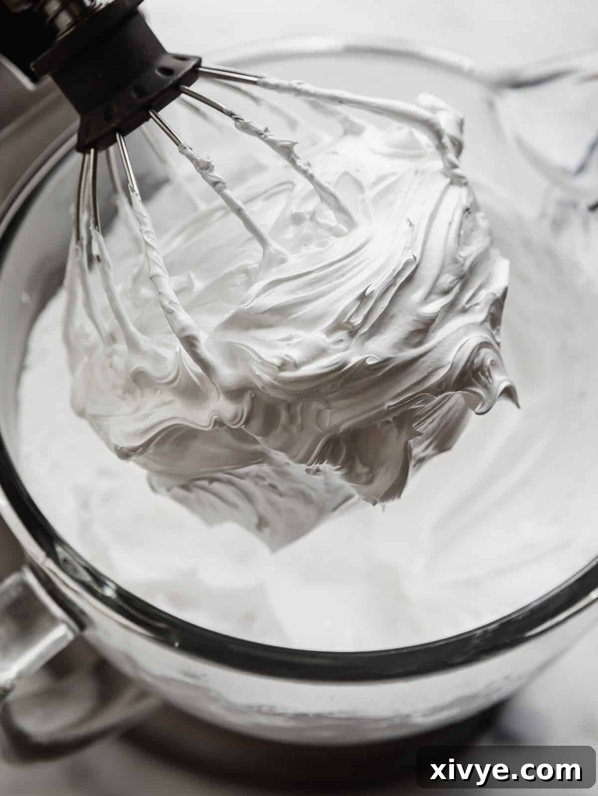 Homemade Marshmallow Cream on a wire whisk.
