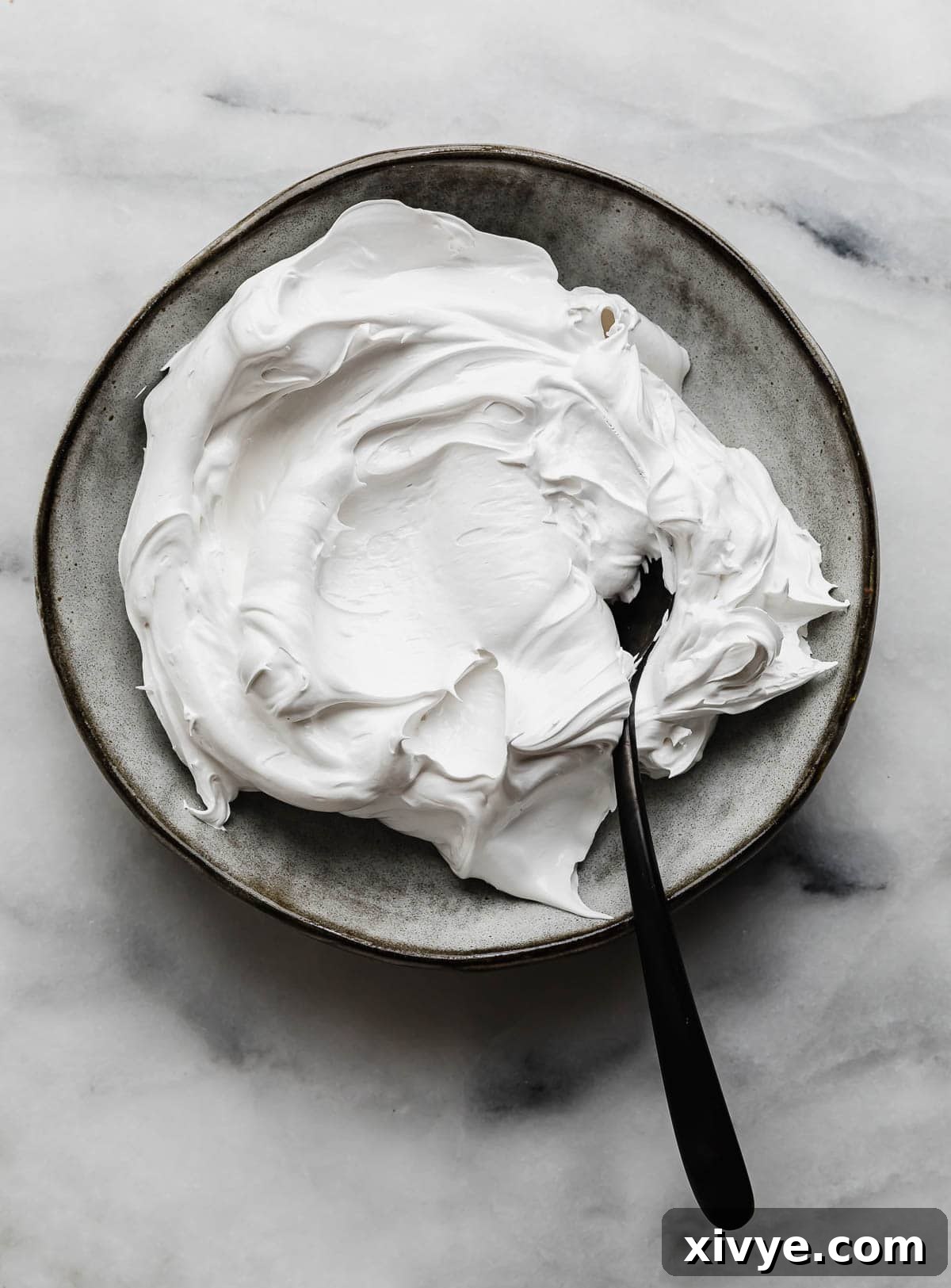 The best Homemade Marshmallow Cream recipe (creme) on a gray plate.