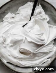 the best Homemade Marshmallow Cream recipe swirled on a gray plate.