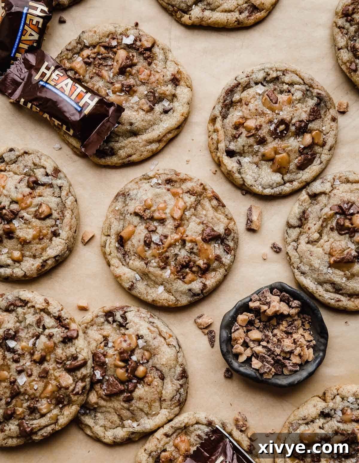 Toffee Crunch Cookies 7 Heath Bar Cookies topped with lots of Heath toffee bits, on a Kraft parchment paper.