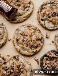 Toffee Crunch Cookies 8 Heath Bar Cookies topped with lots of Heath toffee bits, on a Kraft parchment paper.
