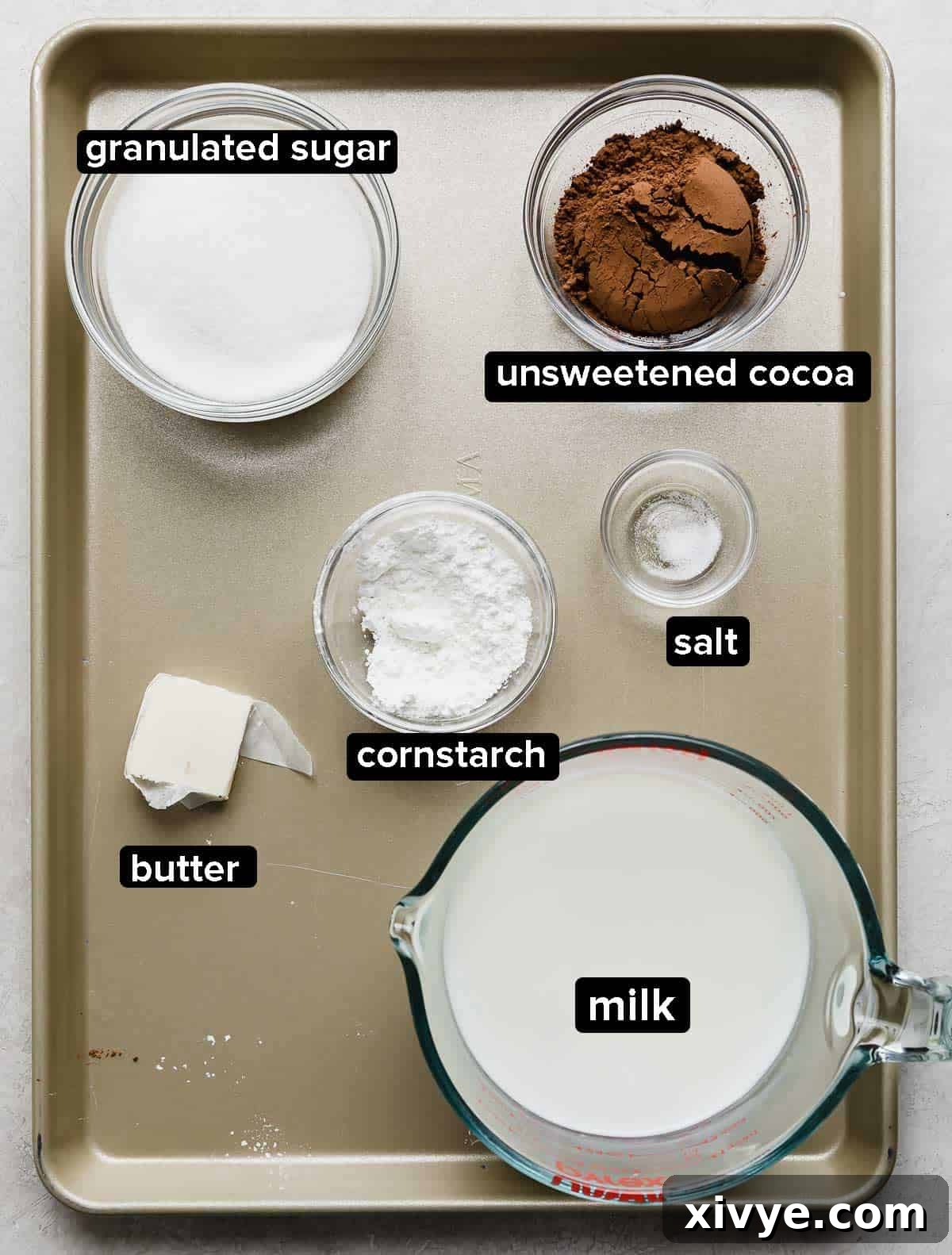 Ingredients used to make a homemade chocolate pudding for a chocolate pudding poke cake.