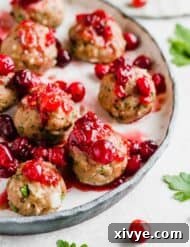 Baked turkey meatballs topped with cranberry chutney sauce.