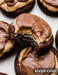 A Buckeye brownie Cookie with a bite taken out of it.