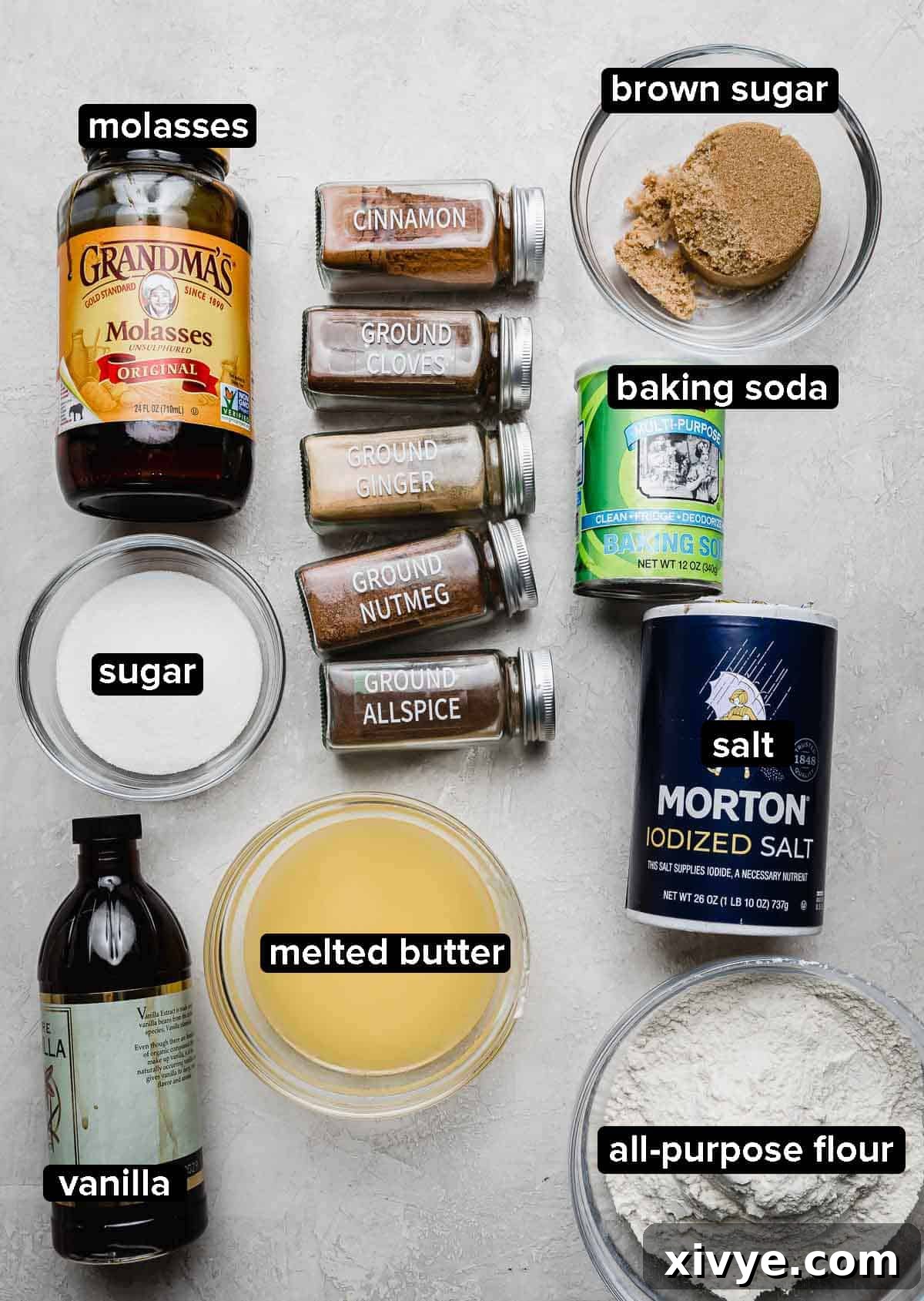 Warm Spiced Ginger Bars 3 Gingerbread Cookie Bar recipe ingredients on a light gray background: molasses, sugar, butter, dry ingredients, salt, and gingerbread spices.