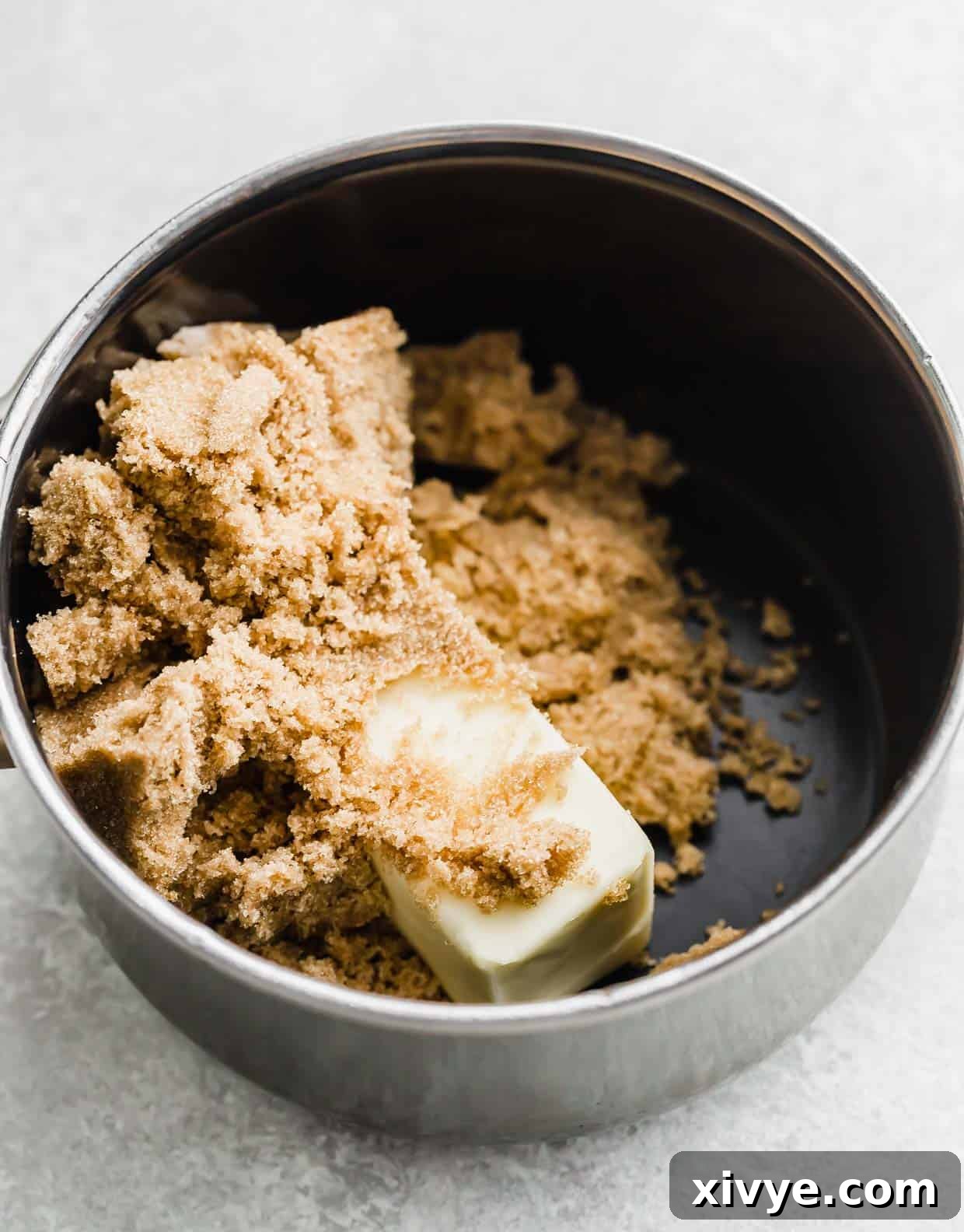 Decadent Caramel Apple Indulgence 4 A pot with butter and brown sugar melting together, the first step for making Homemade Caramel Apple Dip.