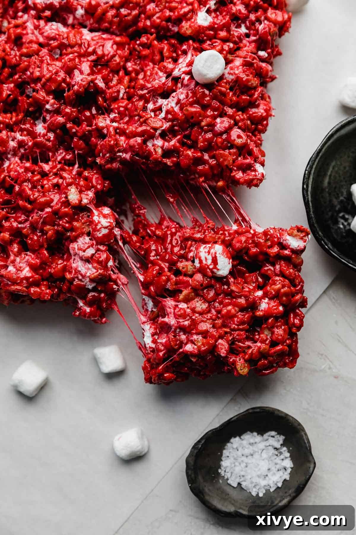 A Red Velvet Rice Krispie treat on a light gray background.