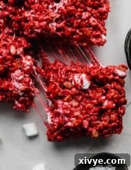 A Red Velvet Rice Krispie treat on a light gray background.