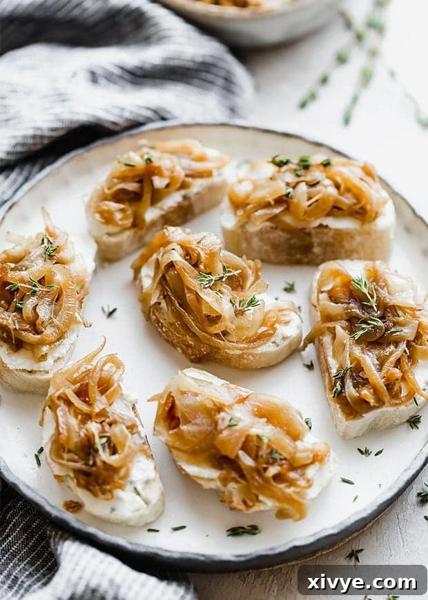 Sweet Caramelized Onion and Tangy Goat Cheese Crostini 5 A plate with caramelized onion topped goat cheese crostini.